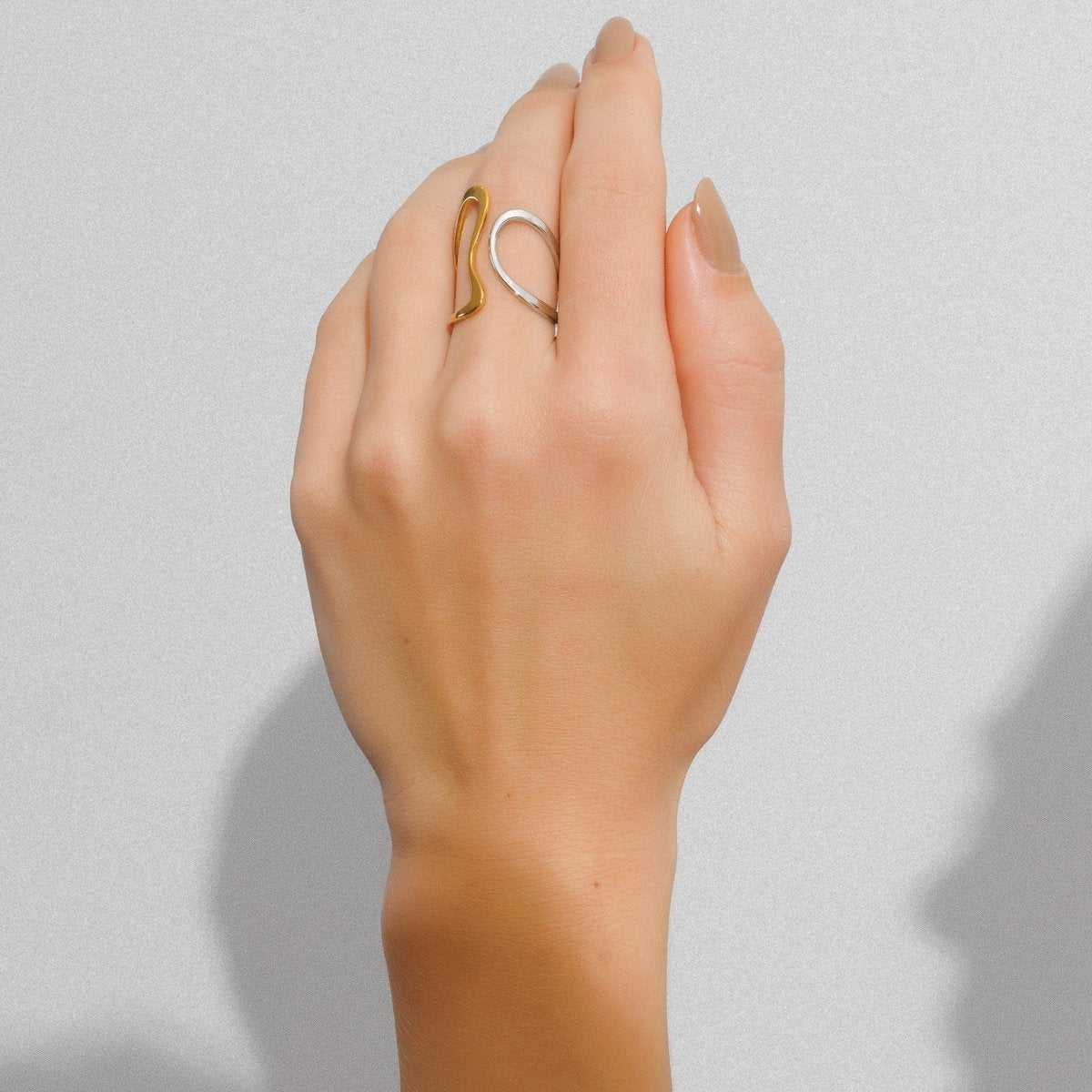 Adjustable contour ring with a mix of gold and silver plating.