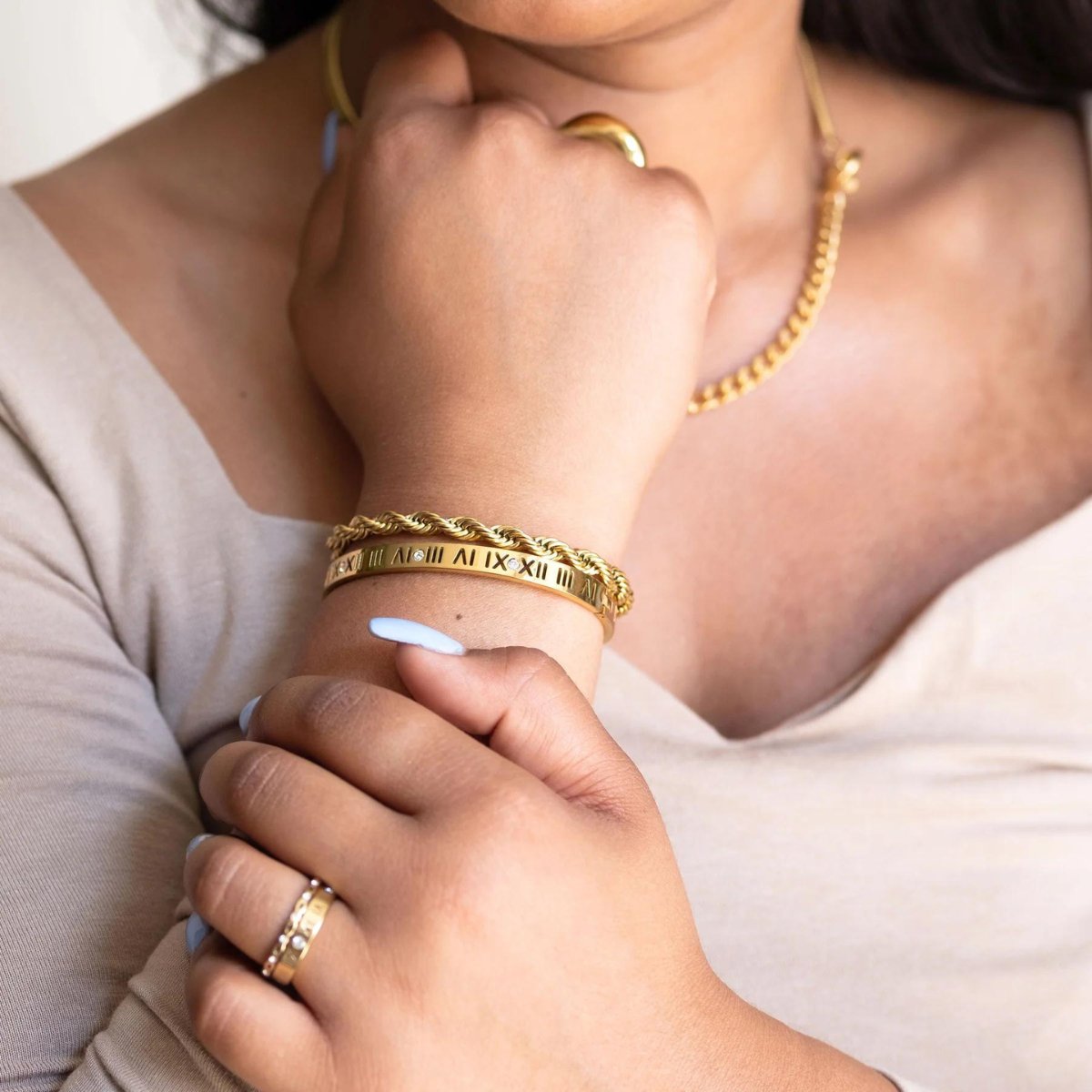 Roman numeral bracelet plated in 18K gold.