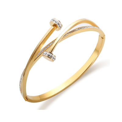 Stud bracelet with cubic zirconia stones, 18K gold plated.
