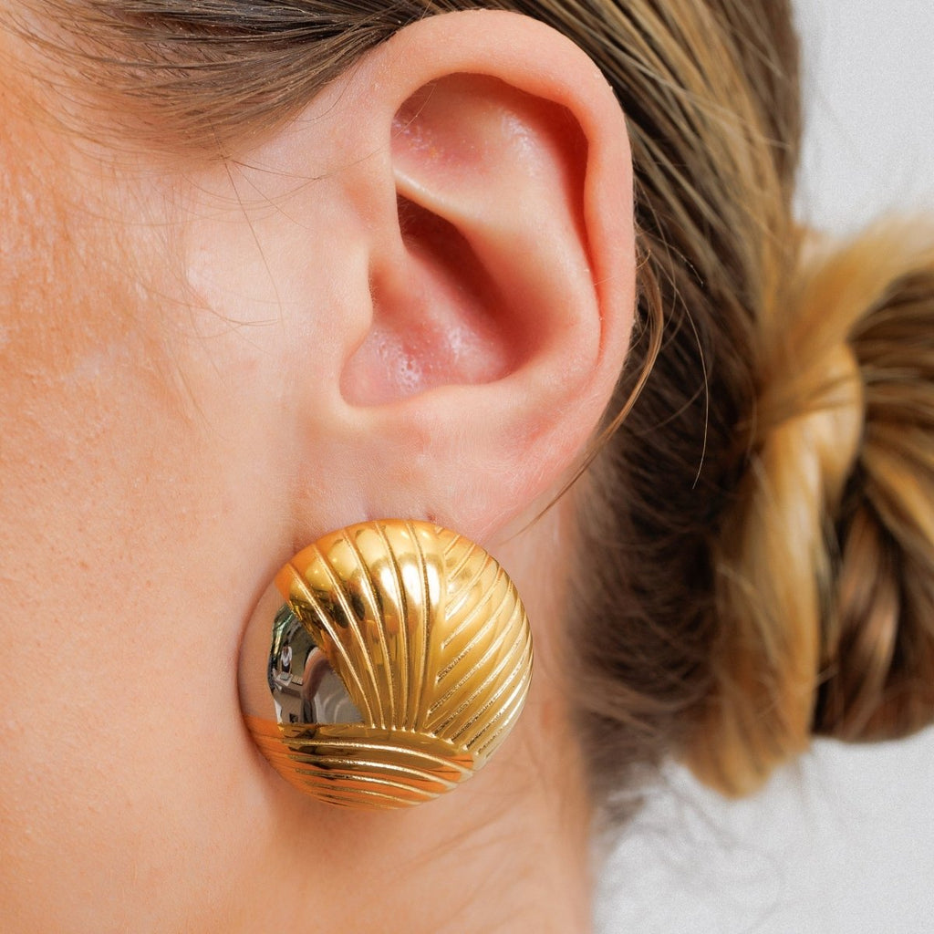 Textured sphere earring with a mix of gold and silver plating.