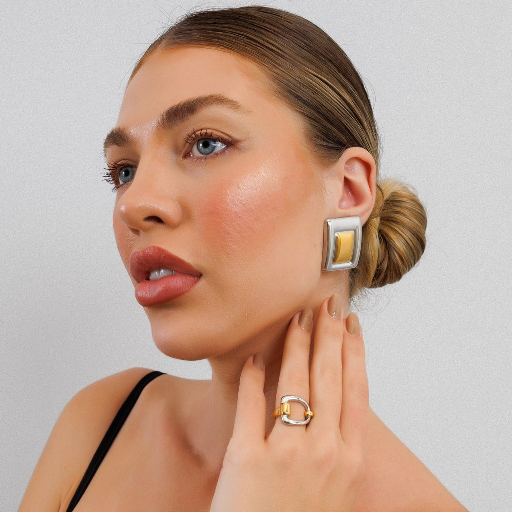 Geometric earring with a mix of gold and silver plating.