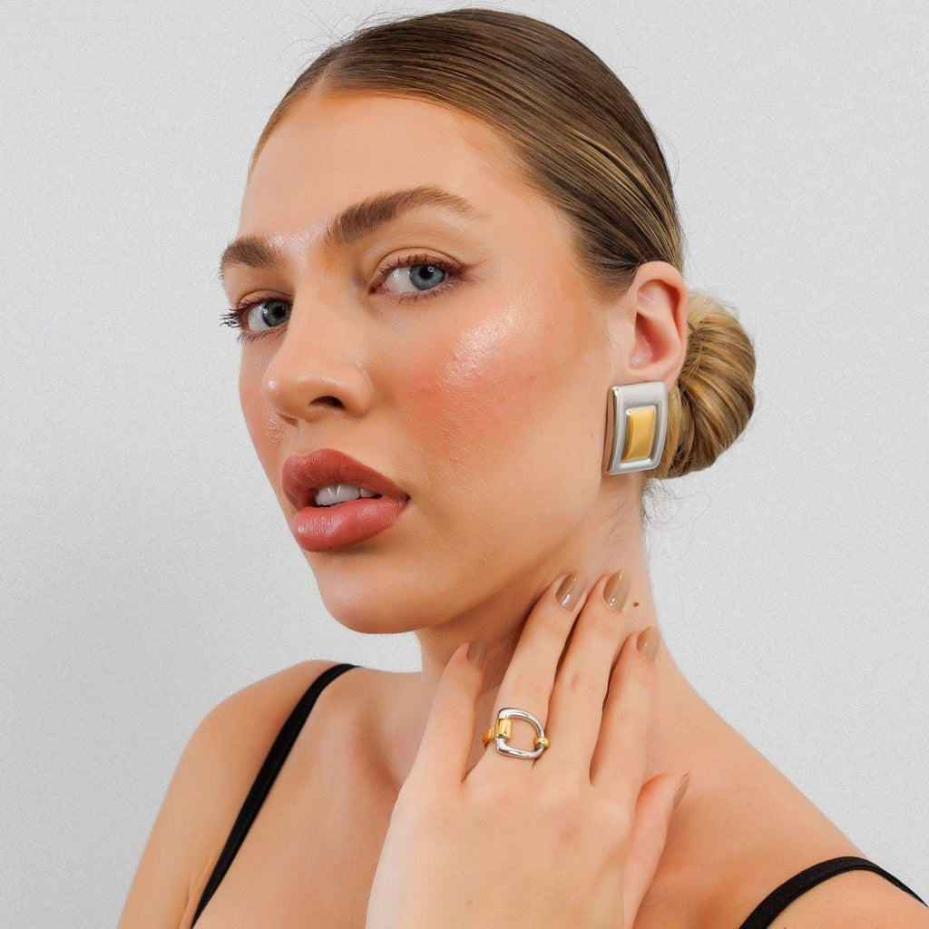 Geometric earring with a mix of gold and silver plating.