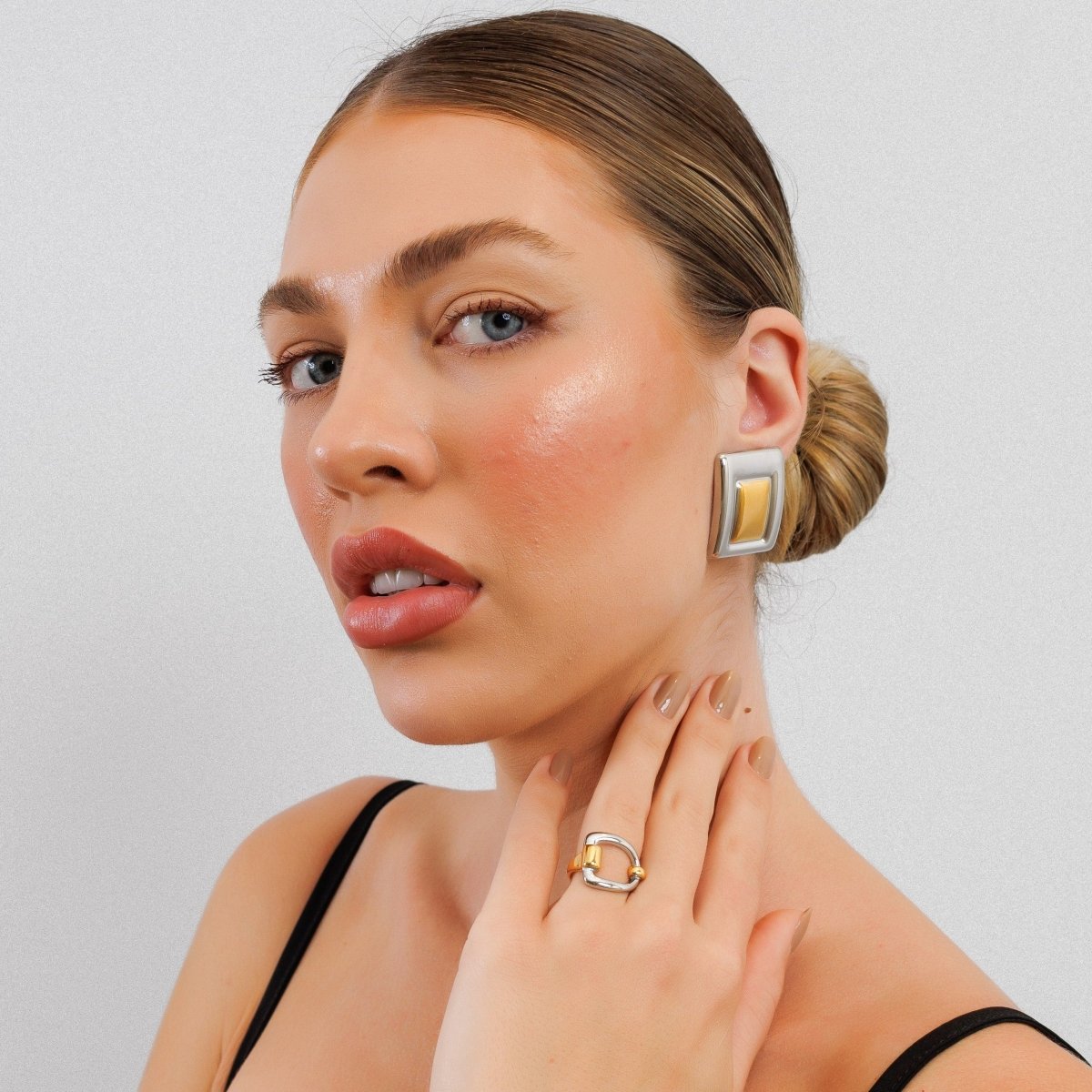 Geometric earring with a mix of gold and silver plating.