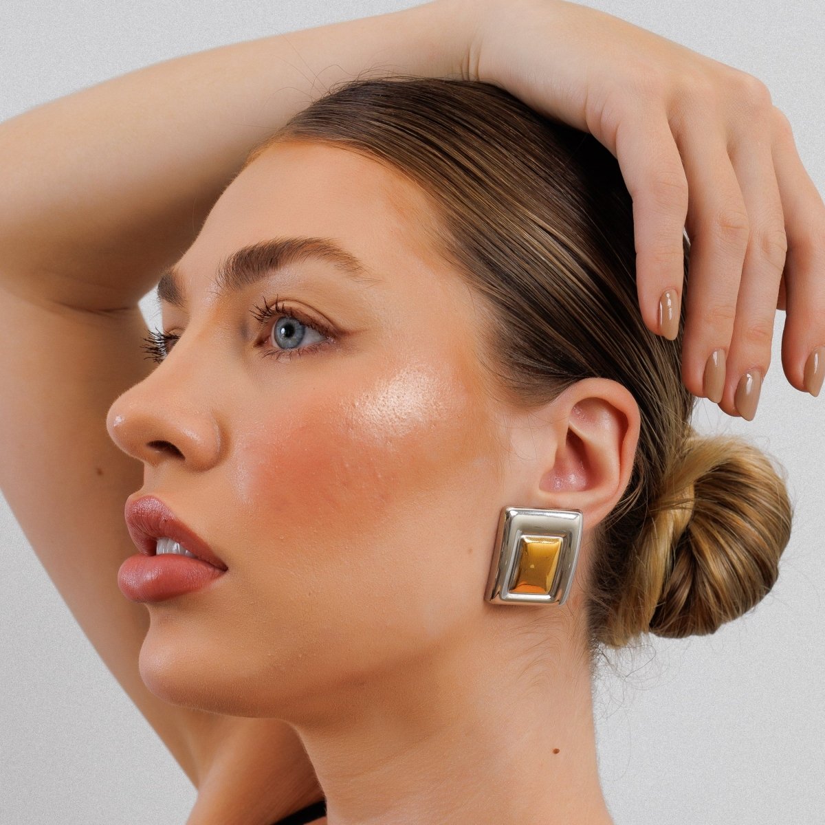 Geometric earring with a mix of gold and silver plating.